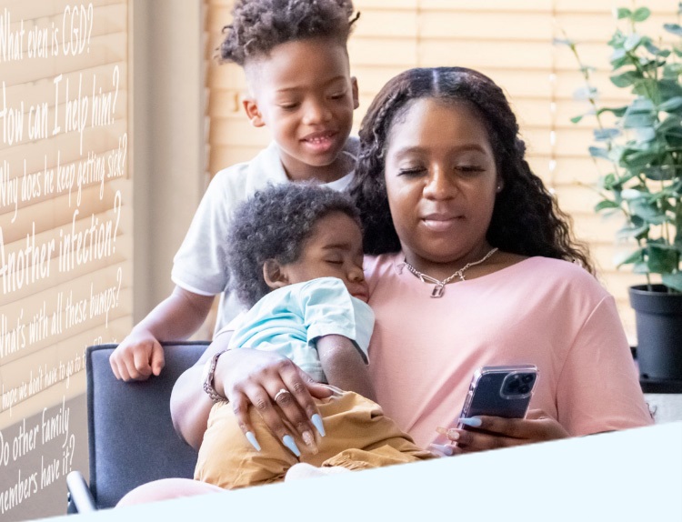 Image of a mother with her two young children, the youngest child has chronic granulomatous disease